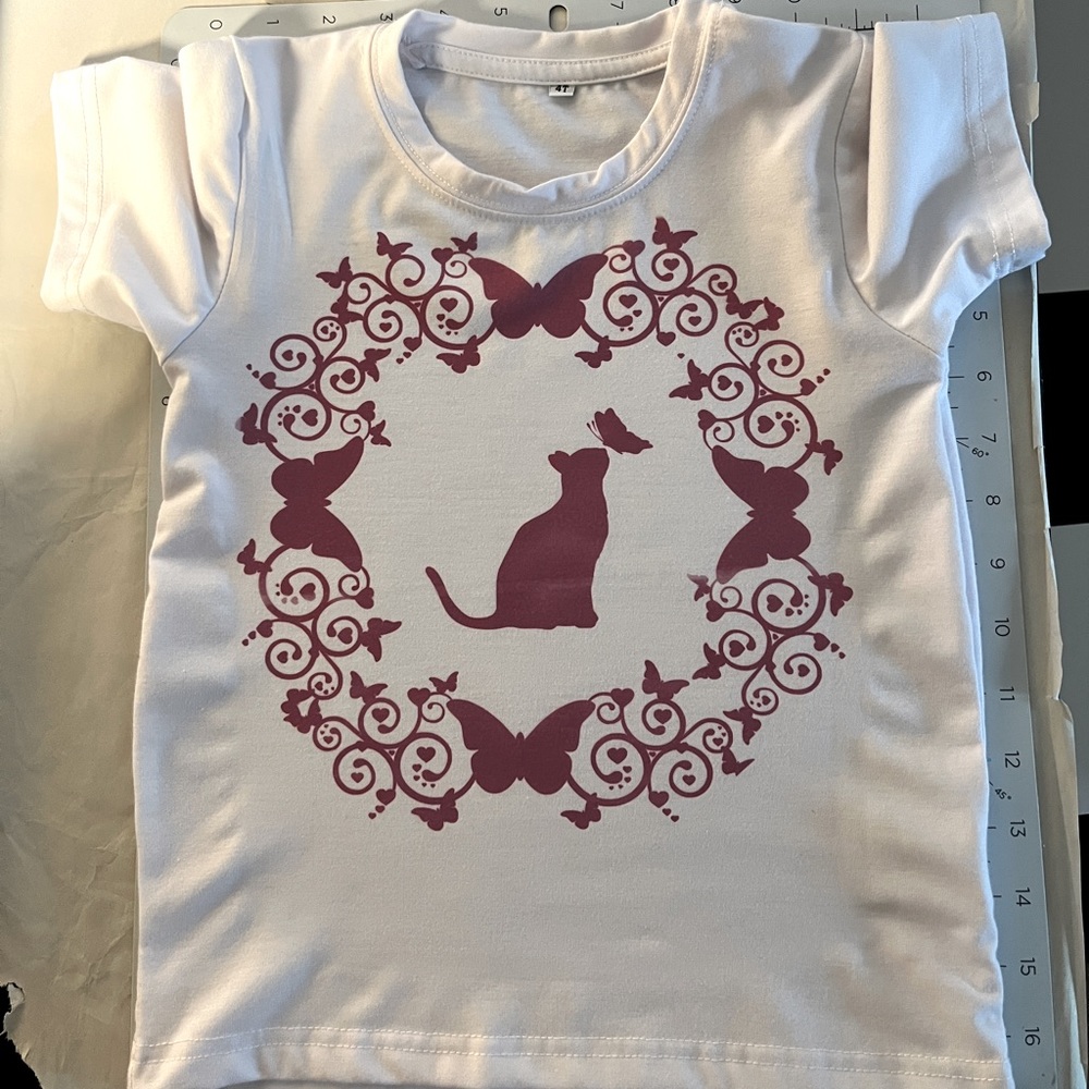 Girls white T-shirt cats and butterflies.